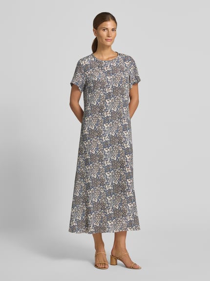 Frauenmodel trägt Tailliertes Freizeitkleid aus reiner Seide Modell 'CRESPO' von Weekend Max Mara mit floralem Allover-Muster, Midi-Länge, Rundhalsausschnitt, Popeline-Textur, Ganzkörperansicht von vorne.