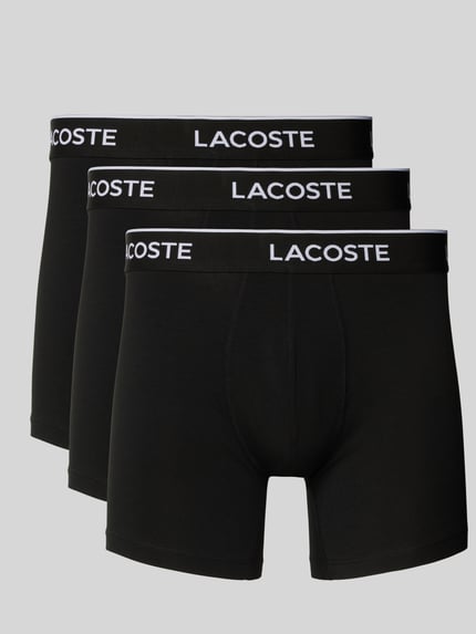 Produktfoto, Boxershorts mit elastischem Label-Bund im 3er-Pack von LACOSTE aus schwarzem Baumwoll-Elasthan-Mix, eng anliegend, weiße Bundaufschrift