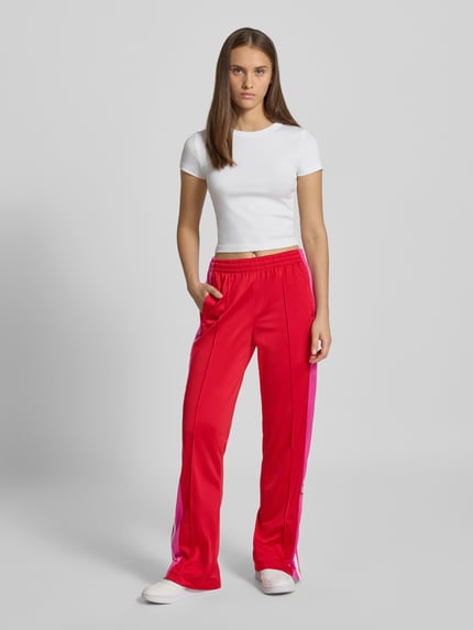 adidas Originals Spodnie sportowe o kroju regular fit z zakładkami w pasie model ‘BREAK’ Czerwony 1