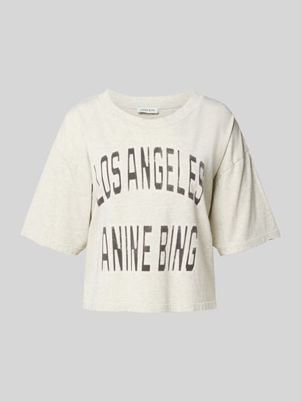 Produktfoto, Oversized T-shirt met logoprint van Anine Bing in gebroken wit, puur katoen, oversized fit, kort model, halflange mouwen, ruglengte maat S 47 cm