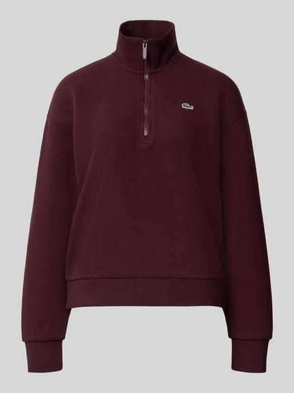Produktfoto, Relaxed Fit Sweatshirt aus Baumwoll-Mix von Lacoste in dunklem Bordeauxrot mit Logo, glatte Textur vor grauem Hintergrund. Damen Sweatshirt von Lacoste