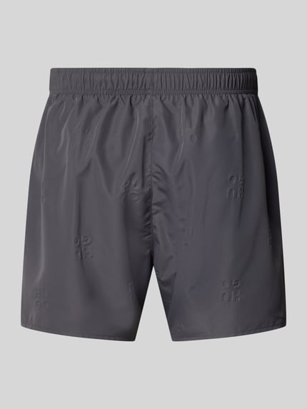 Produktfoto, Regular Fit Badeshorts mit Label-Prägung Modell 'TONAL' von HUGO in Optik: Unifarben, elastischer Bund, seitliche Eingrifftaschen, glatte Textur.