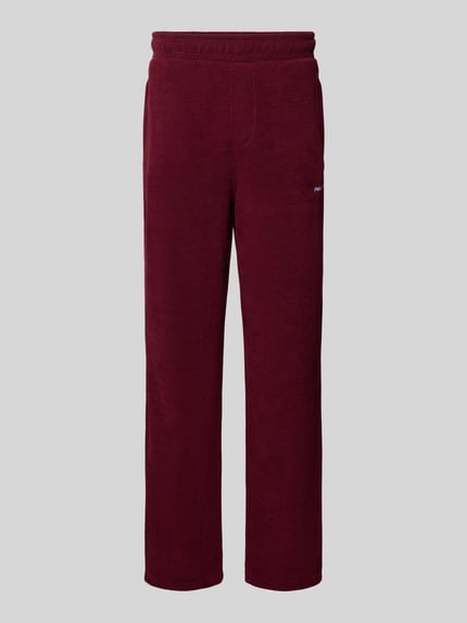 Wide Fit Sweatpants mit Label-Detail Modell 'Mezzano' Shop The Look MANNEQUINE