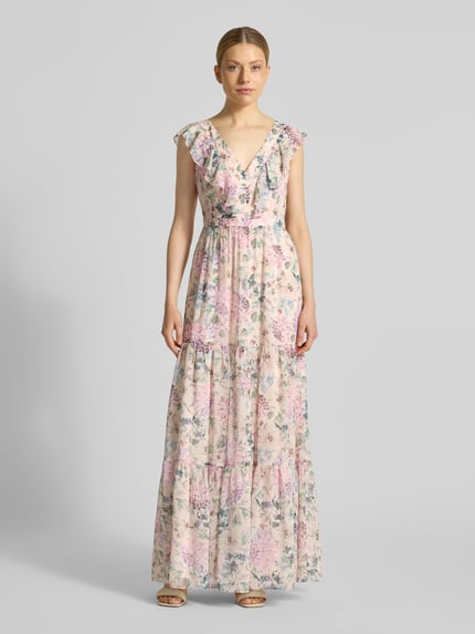 Vrouwenmodel draagt avondjurk met volantzoom en V-hals van Swing, bloemenprint, getailleerd chiffon, maxi-jurk, Ganzkörperansicht von vorne.