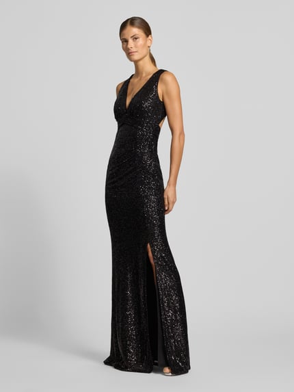 Modelka kobieca nosi 'Abendkleid mit Pailletten-Cut-Out' od JAKE*S COCKTAIL, czarny, błyszczący satynowy materiał z cekinami, dopasowany krój, maxi, wycięcie, marszczenie, głęboki dekolt V, szerokie ramiączka, bez rękawów, rozcięcie u dołu, widok całej sylwetki z przodu.