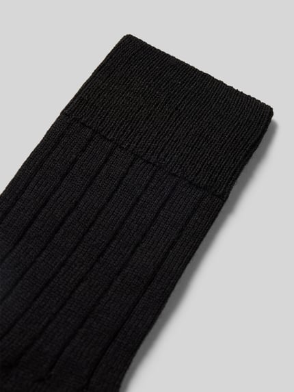 Produktfoto, Strümpfe aus Schurwollmischung Modell 'Teppich im Schuh' von FALKE in Schwarz, Rippenstruktur, verstärkte Belastungszonen, gepolsterte Sohle