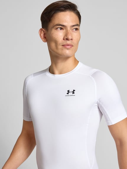 Under Armour T-shirt z o kroju slim fit z nadrukiem z logo Biały 3