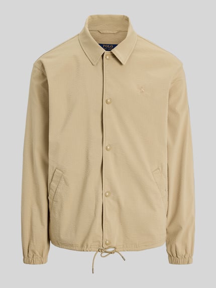 Produktfoto, Regular Fit Blouson aus Baumwoll-Mix Modell 'SEERSUCKER' von Polo Ralph Lauren, Optik: Unifarben, Muster: Gestreift, Kragenform: Umlegekragen, Verschluss: Druckknopfleiste, Logo-Stitching, Ärmelform: Langarm, Ärmelabschluss: Elastisch, Rumpfabschluss: Tunnelzug, seitliche Eingrifftaschen, Materialverarbeitung: Twill-Stretch, Farbe beige, griffige Seersucker-Struktur