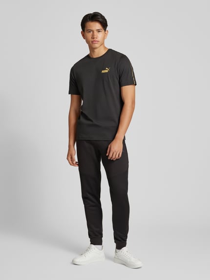 PUMA Performance Spodnie dresowe o kroju regular fit z detalem z logo Czarny 1