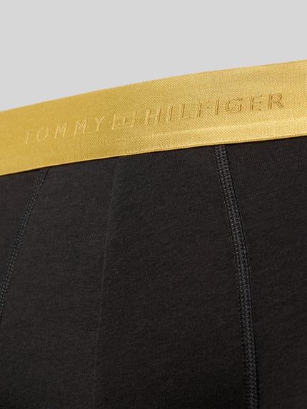 Produktfoto, Trunks mit elastischem Logo-Bund im 3er-Pack von Tommy Hilfiger, Jersey-Material, schwarze Unifarbe, goldener Logo-Bund, strukturierte Optik