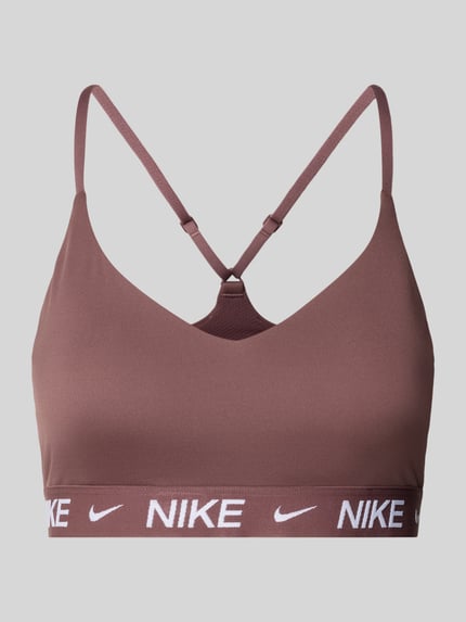 Produktfoto, bustier met labeldetails en verstelbare bandjes van Nike Training, nauwsluitende pasvorm, elastische band, effen bruin, gladde textuur