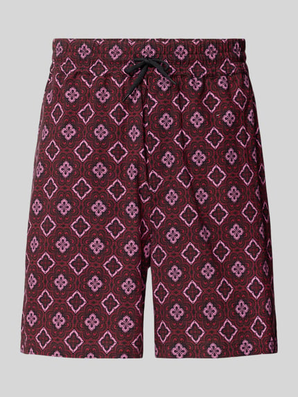 Produktfoto, Shorts mit elastischem Bund Modell 'Harry' von Les Deux aus reiner Bio-Baumwolle im Loose-Fit mit Kordelzug, Eingrifftaschen, Gesäßtasche und Label-Detail, Grundfarbe Bordeaux mit geometrischem Muster.