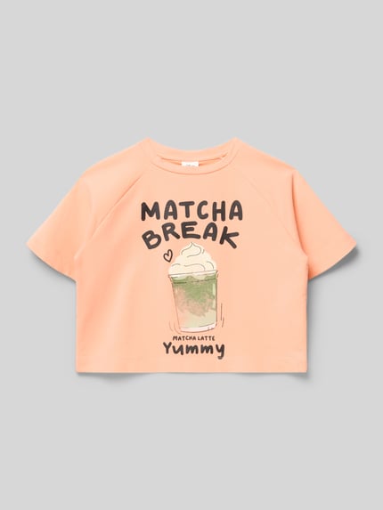 Produktfoto, Boxy Fit T-Shirt aus Baumwoll-Mix von s.Oliver RED LABEL, Kinder T-Shirt in Optik: Unifarben, Applikation: Schriftzug, Motiv-Print, Rundhals, Ärmelform: Kurzarm, Raglanärmel, pastellorange, glatte Textur.