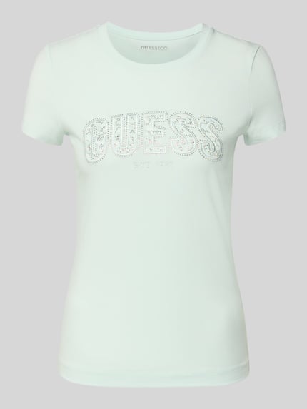 Produktfoto, Slim Fit T-Shirt mit Strasssteinbesatz von Guess, elastyczna mieszanka bawełny, krój slim fit, dekolt okrągły, detal logo