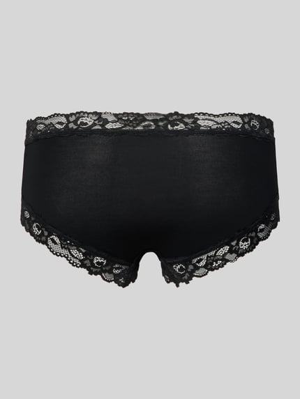 Frauenmodel trägt Slim Fit Panties mit Spitzenbesatz von Skiny, schwarz, florale Optik, elastischer Micromodal-Elasthan-Mix, Ganzkörperansicht Rückansicht.
