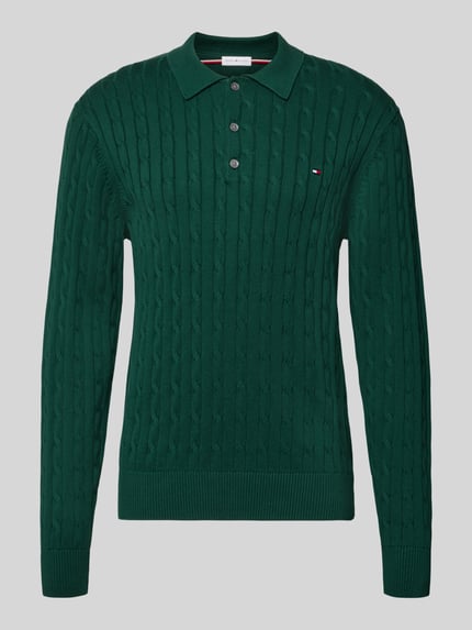 Produktfoto, Regular Fit Pullover aus reiner Baumwolle von Tommy Hilfiger in Dunkelgrün mit Zopfmuster und strukturierter Oberfläche.