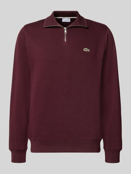 Produktfoto, bordeauxroter Regular Fit Troyer aus reiner Baumwolle von Lacoste, dezente Struktur, sichtbarer Zipper, Herren Troyer von Lacoste