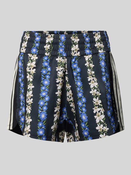 Produktfoto, Regular Fit Sportshorts mit elastischem Bund von adidas Sportswear, florales Muster in Blau und Weiß, glatte Textur