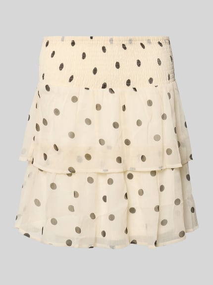 Produktfoto, Mini-Rock aus Chiffon Modell 'SMILLA' von Vero Moda mit cremefarbenem Allover-Punktmuster, ausgestellte Passform, Volants, gesmokter elastischer Bund, transparente leichte Textur