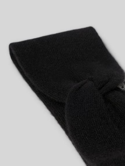 Produktfoto, Stirnband aus reinem Kaschmir von Christian Berg Woman in Schwarz, breites Design, Strick-Optik, Knotendetail, weiche Textur
