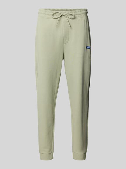 Produktfoto, Relaxed Fit Sweatpants aus reiner Baumwolle Modell 'NAPIN` von HUGO BLUE, efekt: jednolity kolor, krój relaxed fit, naszywka z logo, tunel, ściągacz, prążkowane zakończenia nogawek, wpuszczane kieszenie, dzianina dresowa z bawełny