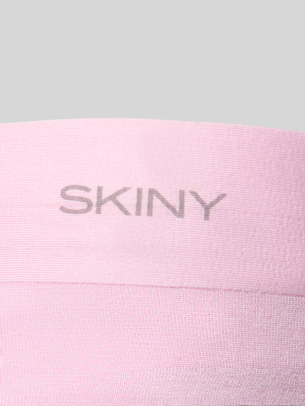 Produktfoto, Slip aus Viskose-Elasthan-Mix Modell 'SMARTOUCH' von Skiny in zartem Rosa mit elastischem Bund und Label-Detail, feine Textur