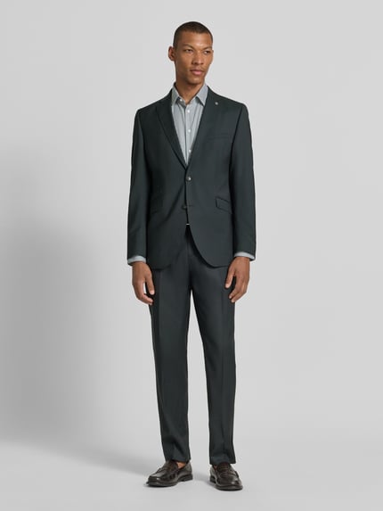 Männermodel trägt dunkelgrünes Slim fit 2-knoops colbert model 'Camden' van CG - Club of Gents van zuivere scheerwol, klepzakken, reverskraag, ruglengte 76 cm, schouderbreedte 50 cm, mouwlengte 68 cm, heren, ganzkörperaanzicht van voren.