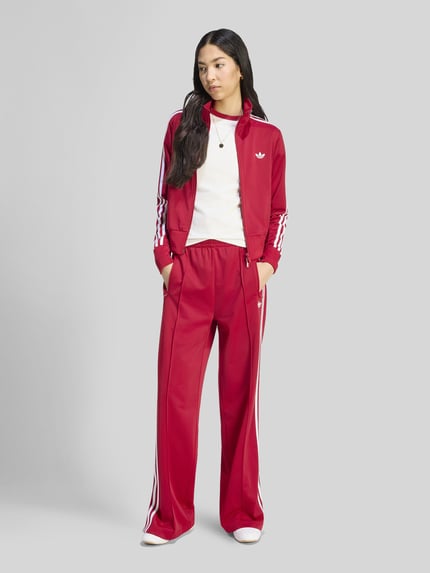 adidas Originals Spodnie dresowe o kroju loose fit z paskami w kontrastowym kolorze Czerwony 1