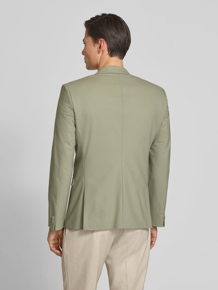Męski model nosi Super Slim Fit Anzugsakko aus Woll-Mix Modell 'ARTI' von HUGO, kolor jednolity, popelina, widok całej sylwetki z tyłu.