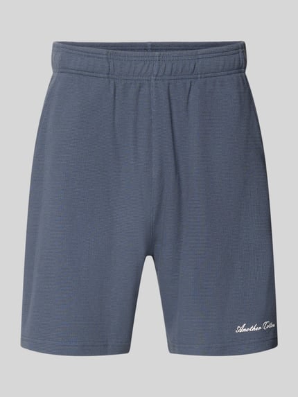 Shorts mit Logo-Print und Eingrifftaschen Shop The Look MANNEQUINE