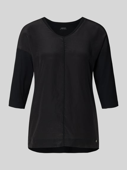 Produktfoto, T-Shirt mit Ärmelaufschlag und Rundhalsausschnitt von Marc Cain, damski t-shirt z mieszanki bawełny z dodatkiem streczu, krój straight fit, okrągły dekolt, rękawy z zakładką, detal z logo, długość tyłu w rozmiarze 36: 62 cm, kolor czarny, gładka struktura