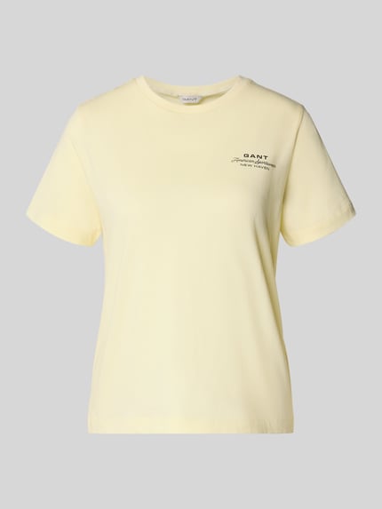 Produktfoto, T-Shirt mit Label-Print und Rundhalsausschnitt von Gant, damski t-shirt z bawełny, krój regular fit, nadruk z logo, okrągły dekolt, długość tyłu w rozmiarze S: 57 cm, jasny żółty, prosta forma, gładka faktura