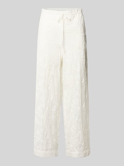 Produktfoto, Wide Fit Stoffhose mit floralem Allover-Design von Mango aus reiner Baumwolle in Weiß, elastischer Bund mit Tunnelzug, florale Musterstruktur