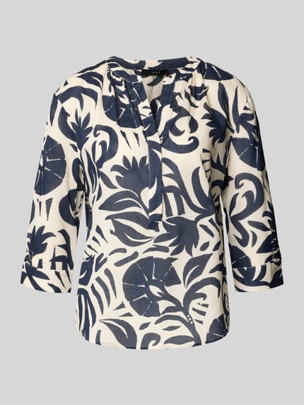 Produktfoto, Bluse mit Tunikakragen und 3/4-Arm von Oui aus reiner Baumwolle, gerader Schnitt, dunkelblaue Muster auf cremefarbenem Stoff