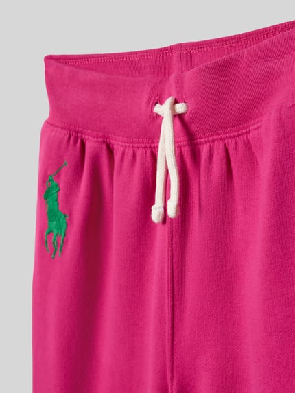 Produktfoto, Regular Fit Sweathose aus Baumwoll-Mix von Polo Ralph Lauren Teens in Pink, unifarben, grünes Logo-Stitching, elastischer Bund mit Tunnelzug, Sweat-Textur, seitliche Eingrifftaschen, Mid Waist.