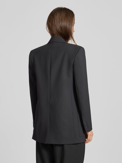 Kobiece model prezentuje Loose Fit Longblazer z dodatkiem żywej wełny Model 'VELOCE' od Weekend Max Mara, efekt: jednolity kolor, długi rękaw, wyhaftowane logo, zapięcie na 2 guziki, nałożona boczna kieszeń, widok całej sylwetki od tyłu.