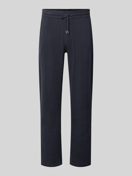 Produktfoto, ciemnogranatowe spodnie dresowe Straight Fit Sweatpants in Musselin-Optik od Lindbergh z bawełny, krój straight fit, efekt muślinu, elastyczny pas z tunelem, szerokość w rozmiarze M: 41 cm, długość wewnętrzna nogawki w rozmiarze M: 81 cm