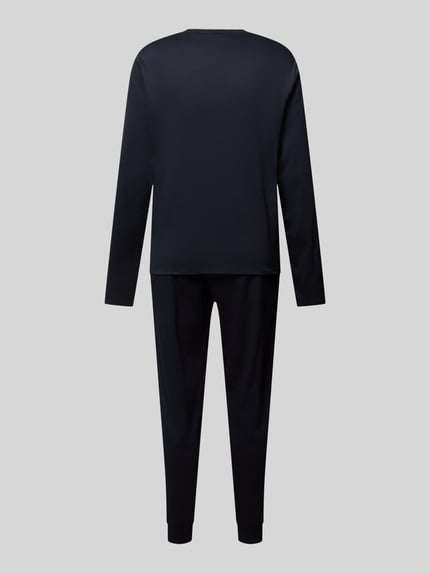 Productfoto, Regular Fit Pyjama-Set uit puur katoen van BOSS Heren pyjama in effen donkerblauw met lange mouwen en broek, gladde textuur.