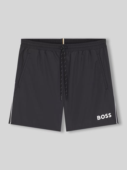 Produktfoto, Badehose mit Paspelnaht in Kontrastfarbe Modell STARFISH von BOSS in Schwarz, unifarbenes Popeline-Material, weißer Label-Schriftzug, seitliche Eingrifftaschen, Gesäßtasche, elastischer Bund mit Tunnelzug.