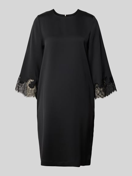 Produktfoto, Knielanges Kleid mit Rundhalsausschnitt Modell 'Dancia' von JOOP!, czarna sukienka, krój relaxed fit, rękaw o dł. 3/4, obszycie koronką, długość do kolan, okrągły dekolt, długość tyłu 100 cm, szerokość klatki piersiowej 49 cm, długość rękawa 65 cm, rozmiar 36.