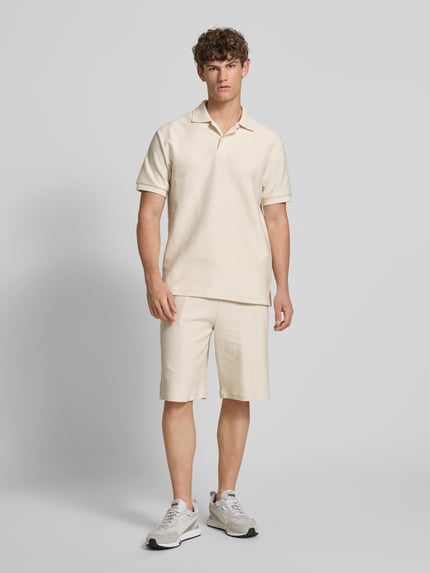 PUMA Performance Relaxed Fit Poloshirt mit Label-Stitching Offwhite 1