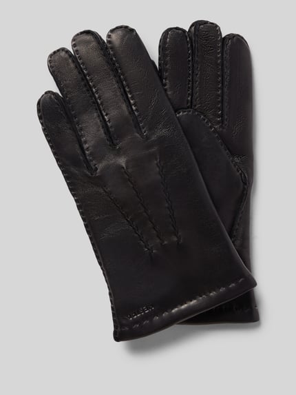 Productfoto, Handschoenen van echt leer model 'Edward' van Hestra, zwarte kleur, deelnaden en labeldetail, context: heren handschoenen.