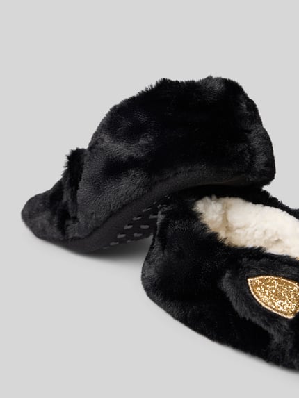 Produktfoto, Kuschelsocken mit Zier-Applikationen und Noppen von CAPELLI NEW YORK, schwarz mit goldfarbenem Detail, flauschige Textur
