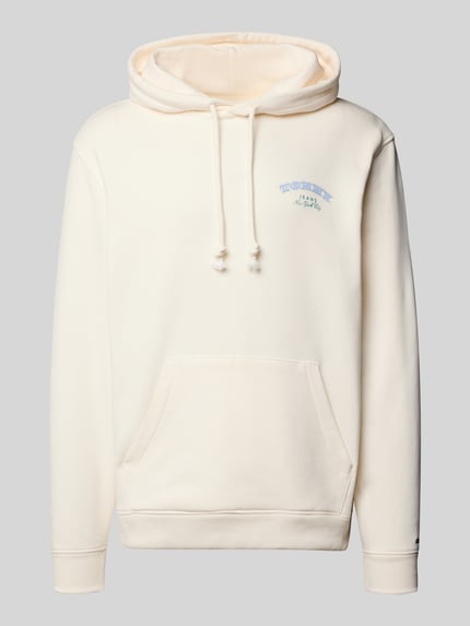 Produktfoto, Regular Fit Hoodie aus reiner Baumwolle von Tommy Jeans w kolorze jednolitym, z kapturem, kieszenią kangurką, bawełniany materiał, detal z logo