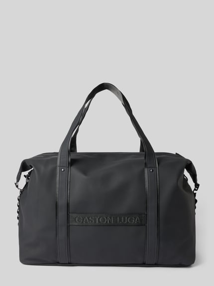 Produktfoto, Weekender mit Logo-Detail Modell 'Däsh' von GASTON LUGA in Schwarz, Hauptfach mit Reißverschluss, glatte Oberfläche, rechteckige Form