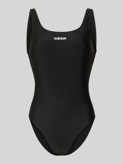 Produktfoto, kostium kąpielowy 'Badeanzug mit Label Print' von adidas Sportswear, efekt: jednolity kolor, nadruk z logo, dekolt w łódkę, bez fiszbin, niewyściełane miseczki, aplikacja z logo