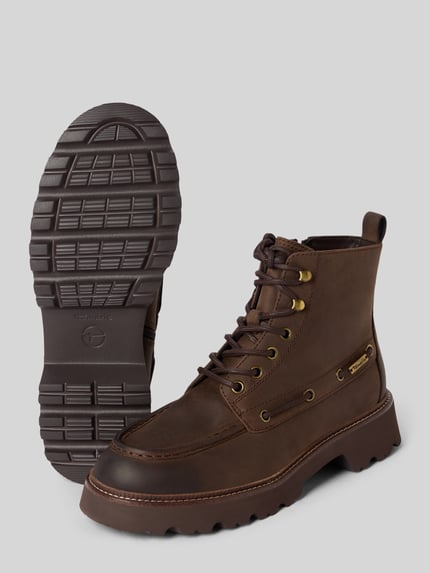 Produktfoto, Schnürstiefel aus Rindnappa mit Profilsohle von Tamaris in uni braun mit Label-Detail, Ziernähte, Anziehschlaufe, Reißverschluss, Schnürung, runde Schuhspitze, Plateau-Blockabsatz und profilierter TR-Gummisohle