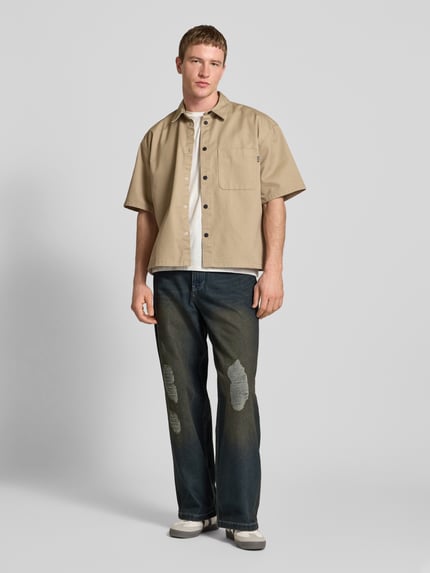 Karl Kani Relaxed baggy fit jeans in destroyed-look, model 'Distress' Jeansblauw - 1