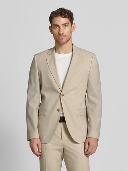 Männermodel trägt Super Slim Fit Anzugsakko aus Schurwoll-Mix Modell 'ARTI' van HUGO in effen kleuren popeline, ganzkörperansicht van voren.