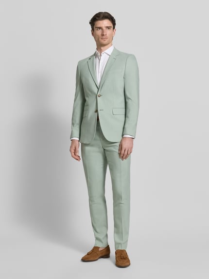 Männermodel trägt Slim Fit Anzugsakko mit Woll-Anteil Modell 'SLIM-NEIL' von SELECTED HOMME, Optik: Unifarben, Ganzkörperansicht von vorne.